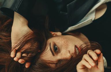 Close-up of hands placed firmly on the floor.