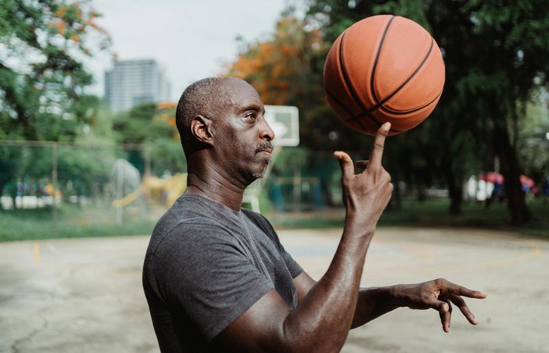 Man holding a difficult balance pose with focus.